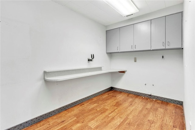 144 S 20th St, South Side, PA 15203 - laundry area featuring light wood-style floors and baseboards