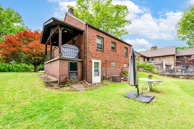 117 Derby Way, Aliquippa, PA 15001 - back of house featuring a chimney, brick siding, and a balcony