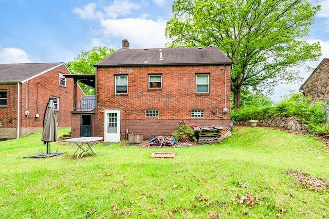 117 Derby Way, Aliquippa, PA 15001 - rear view of property featuring a chimney, a yard, and brick siding