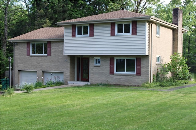 1502 Orchard Dr, Unity Twp, PA 15601 - split level home featuring a chimney, a front lawn, an attached garage, and brick siding