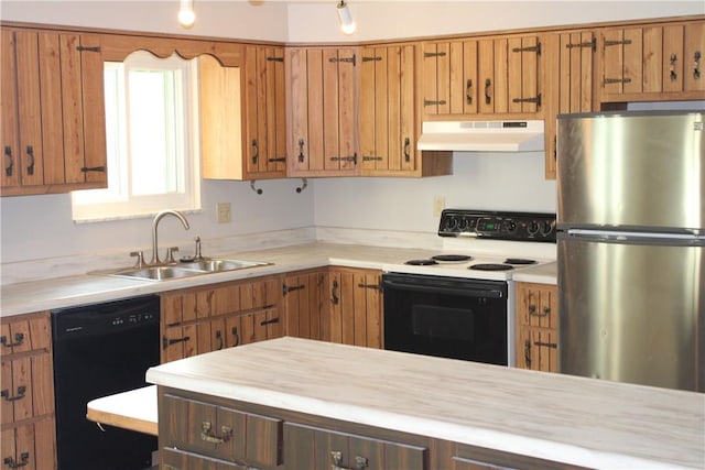 1502 Orchard Dr, Unity Twp, PA 15601 - kitchen with freestanding refrigerator, electric range oven, dishwasher, under cabinet range hood, and light countertops