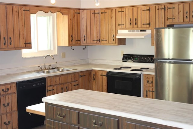 1502 Orchard Dr, Unity Twp, PA 15601 - kitchen featuring freestanding refrigerator, under cabinet range hood, electric stove, dishwasher, and a sink