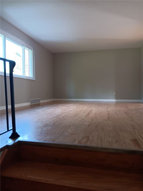 1502 Orchard Dr, Unity Twp, PA 15601 - spare room with wood finished floors and baseboards