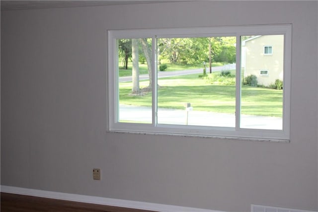 1502 Orchard Dr, Unity Twp, PA 15601 - spare room featuring healthy amount of natural light, baseboards, and dark wood-type flooring