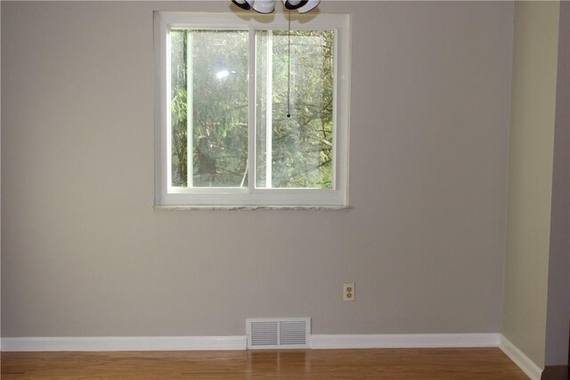 1502 Orchard Dr, Unity Twp, PA 15601 - unfurnished room with baseboards and wood finished floors