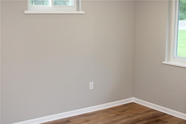 1502 Orchard Dr, Unity Twp, PA 15601 - spare room featuring baseboards and dark wood-style flooring