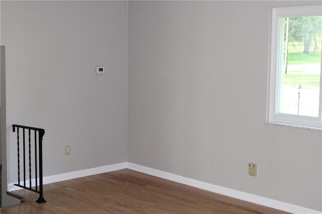 1502 Orchard Dr, Unity Twp, PA 15601 - unfurnished room featuring wood finished floors, plenty of natural light, and baseboards