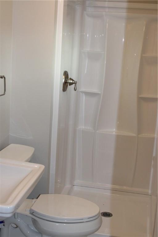 1502 Orchard Dr, Unity Twp, PA 15601 - full bath with a stall shower and toilet