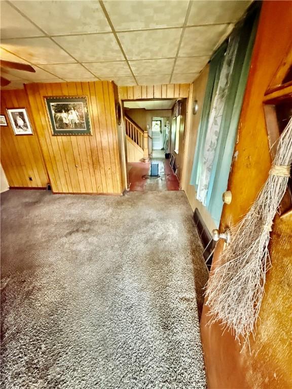 411 E Ave, Luzerne Twp, PA 15413 - interior space with stairs, wooden walls, and carpet floors
