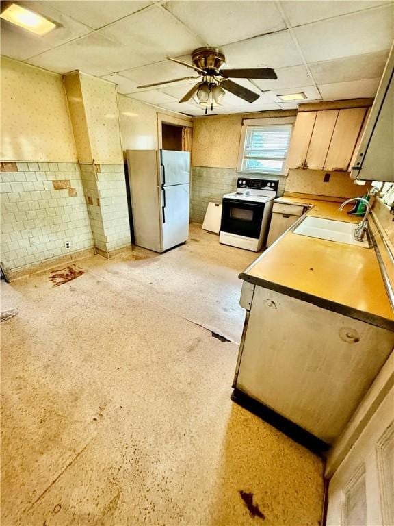 411 E Ave, Luzerne Twp, PA 15413 - kitchen with freestanding refrigerator, electric range oven, a drop ceiling, a sink, and ceiling fan