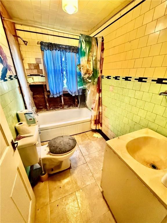 411 E Ave, Luzerne Twp, PA 15413 - full bathroom with toilet, tile walls, shower / bath combo, tile patterned floors, and vanity