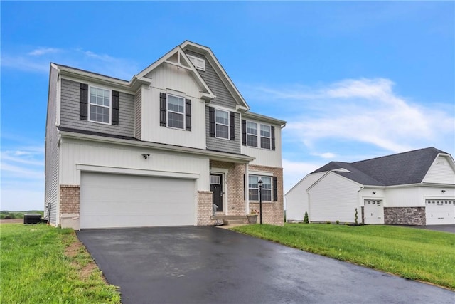 159 Twin Oaks Dr, Buffalo Twp But, PA 16055 - view of front facade with brick siding, driveway, an attached garage, a front lawn, and central AC unit