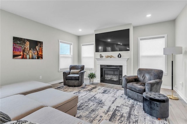 159 Twin Oaks Dr, Buffalo Twp But, PA 16055 - living area featuring wood finished floors, a glass covered fireplace, recessed lighting, and baseboards