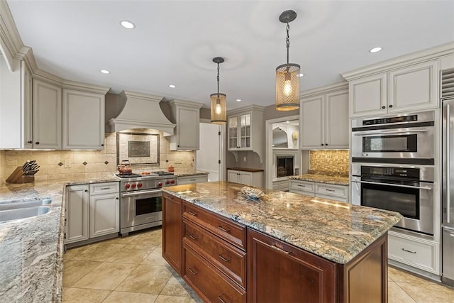 152 Devonwood Dr, Upper St Clair, PA 15241 - kitchen featuring appliances with stainless steel finishes, premium range hood, tasteful backsplash, light tile patterned floors, and recessed lighting