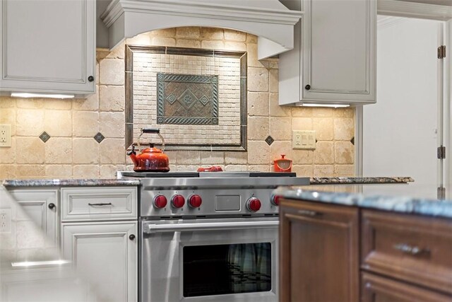 152 Devonwood Dr, Upper St Clair, PA 15241 - kitchen featuring premium stove, backsplash, and white cabinetry