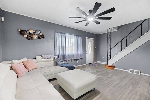 545 Ohio Ave, Midland Boro, PA 15059 - living area featuring wood finished floors, stairway, a ceiling fan, and baseboards