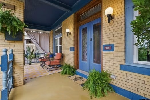 715 Chislett, East Liberty, PA 15206 - property entrance with french doors, brick siding, and covered porch