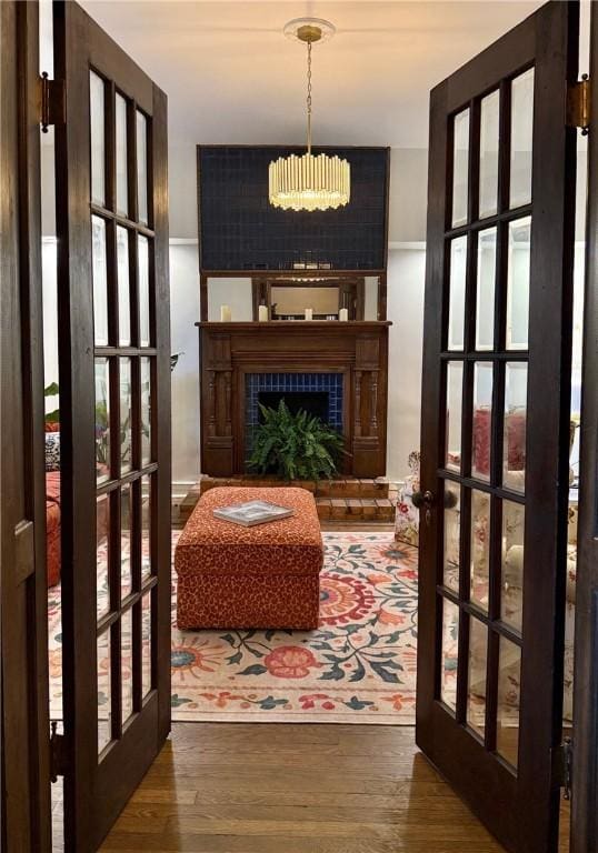 715 Chislett, East Liberty, PA 15206 - corridor with french doors, wood finished floors, and a chandelier