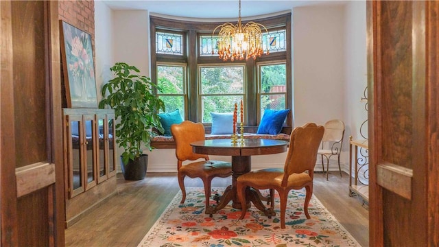 715 Chislett, East Liberty, PA 15206 - dining area featuring a chandelier, wood finished floors, and baseboards