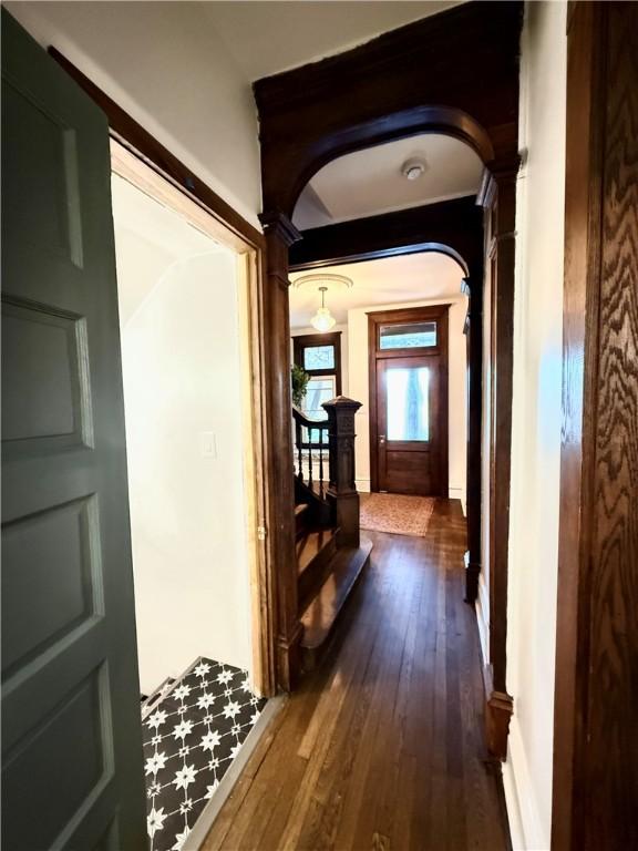 715 Chislett, East Liberty, PA 15206 - hallway featuring arched walkways, dark wood-style floors, and baseboards