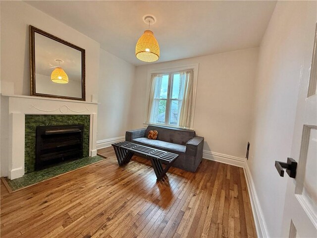 715 Chislett, East Liberty, PA 15206 - living area featuring wood-type flooring, baseboards, and a fireplace with flush hearth