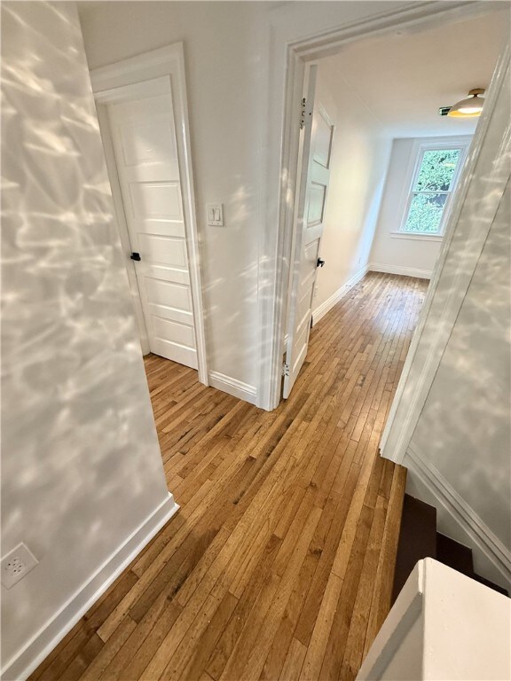 715 Chislett, East Liberty, PA 15206 - hallway with baseboards and hardwood / wood-style floors
