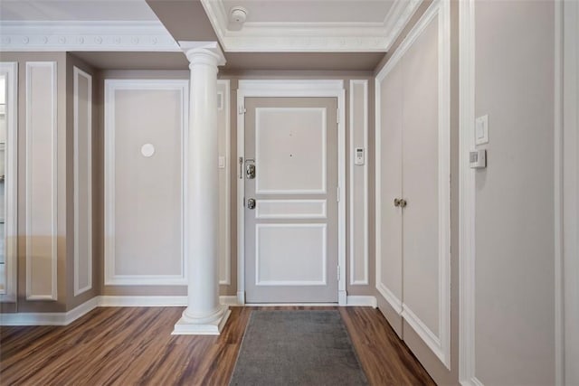 128 N Craig St Unit 415, Oakland, PA 15213 - entryway featuring ornate columns, a decorative wall, dark wood finished floors, and ornamental molding