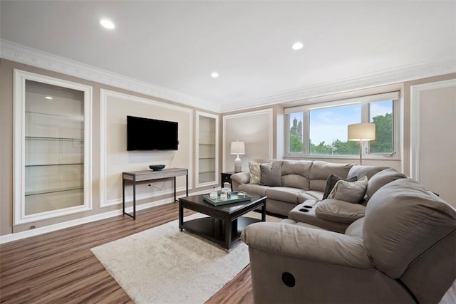 128 N Craig St Unit 415, Oakland, PA 15213 - living area with crown molding, wood finished floors, built in features, recessed lighting, and baseboards