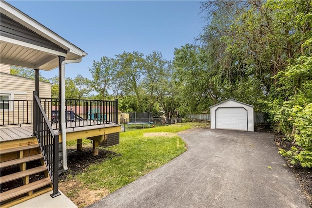 421 W College St, Canonsburg, PA 15317 - view of yard with a trampoline, stairs, a deck, an outdoor structure, and a detached garage