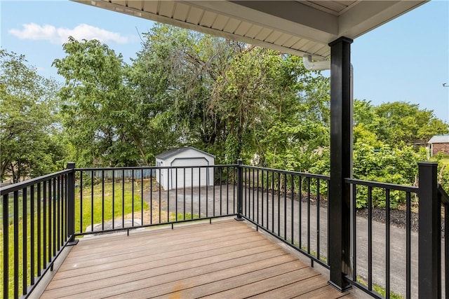 421 W College St, Canonsburg, PA 15317 - wooden terrace with an outbuilding, a garage, and view of wooded area