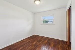 200 Edgewood Dr, Hopewell Twp Bea, PA 15001 - unfurnished bedroom with baseboards, dark wood-style flooring, and a closet