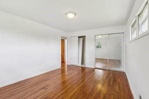 200 Edgewood Dr, Hopewell Twp Bea, PA 15001 - unfurnished bedroom featuring wood finished floors and multiple closets