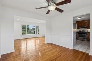 200 Edgewood Dr, Hopewell Twp Bea, PA 15001 - unfurnished living room with wood finished floors and a ceiling fan