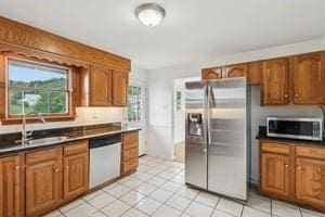 200 Edgewood Dr, Hopewell Twp Bea, PA 15001 - kitchen with stainless steel appliances, a sink, and brown cabinetry