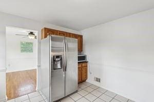 200 Edgewood Dr, Hopewell Twp Bea, PA 15001 - kitchen with stainless steel appliances, light tile patterned flooring, brown cabinetry, and ceiling fan