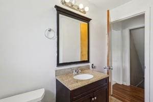 200 Edgewood Dr, Hopewell Twp Bea, PA 15001 - bathroom with vanity, toilet, and wood finished floors