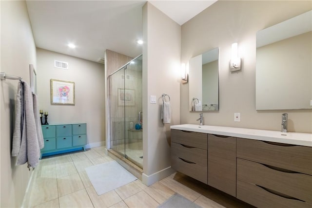 4707 Hatfield St, Lawrenceville, PA 15201 - bathroom featuring double vanity, a stall shower, and tile patterned flooring
