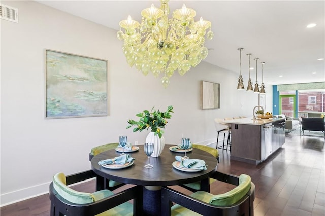 4707 Hatfield St, Lawrenceville, PA 15201 - dining room featuring dark wood-style floors, a chandelier, and recessed lighting