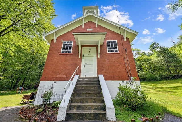 2554 Rte 259, Fairfield Twp, PA 15923 - view of front of home featuring brick siding and a front lawn