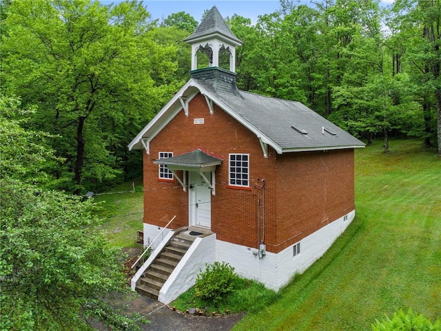 2554 Rte 259, Fairfield Twp, PA 15923 - view of front of house featuring crawl space, brick siding, a front lawn, and a shingled roof