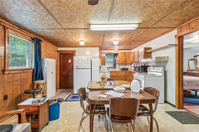 2554 Rte 259, Fairfield Twp, PA 15923 - dining room with wood walls and light flooring