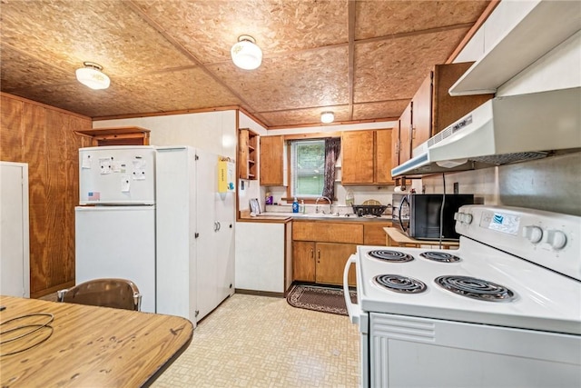 2554 Rte 259, Fairfield Twp, PA 15923 - kitchen featuring white appliances, brown cabinetry, a sink, light countertops, and ornamental molding