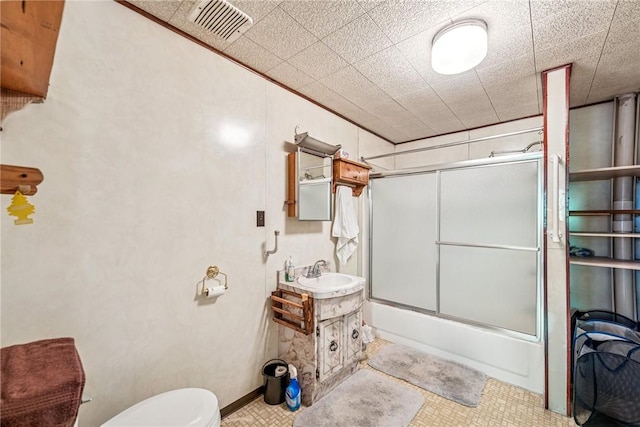 2554 Rte 259, Fairfield Twp, PA 15923 - bathroom featuring vanity, shower / bath combination with glass door, and toilet