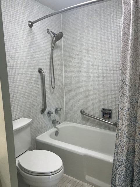 320 Fort Duquesne Blvd Unit 18F, Downtown Pgh, PA 15222 - bathroom with shower / bath combination with curtain, toilet, and tile patterned floors