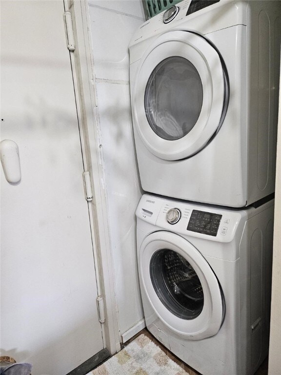 320 Fort Duquesne Blvd Unit 18F, Downtown Pgh, PA 15222 - washroom featuring estacked washer and dryer