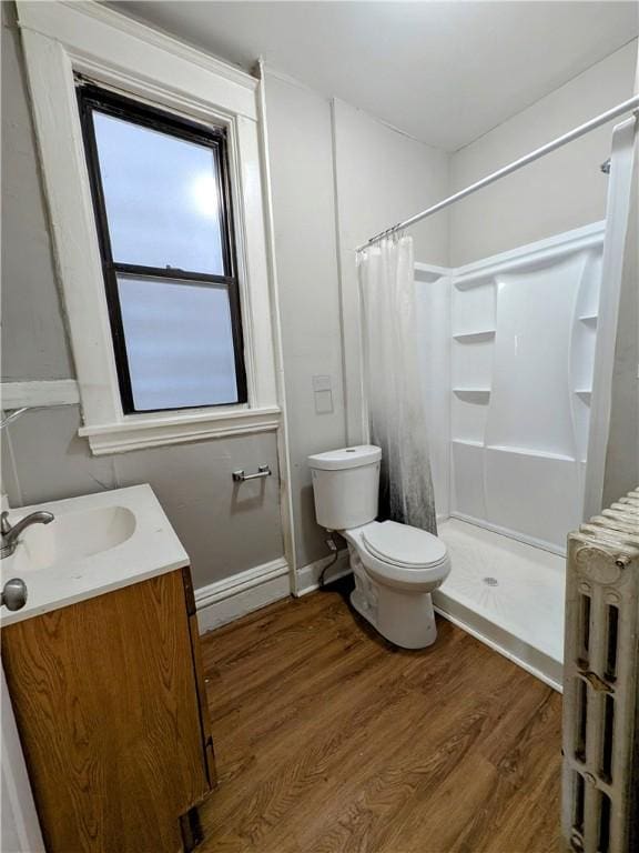 2759 Glen Mawr St, Sheraden, PA 15204 - bathroom featuring a stall shower, vanity, toilet, and wood finished floors