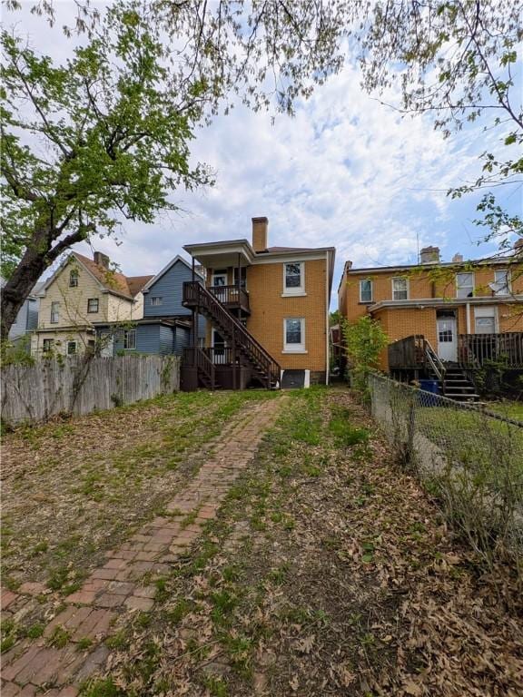 2759 Glen Mawr St, Sheraden, PA 15204 - back of house with stairway and a chimney