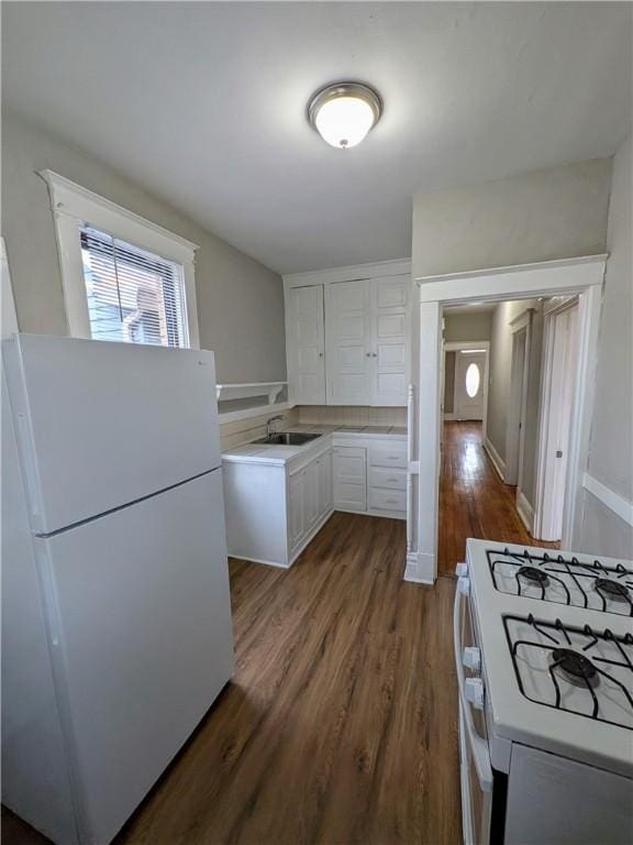 2759 Glen Mawr St, Sheraden, PA 15204 - kitchen with white appliances, dark wood-style floors, white cabinets, and light countertops