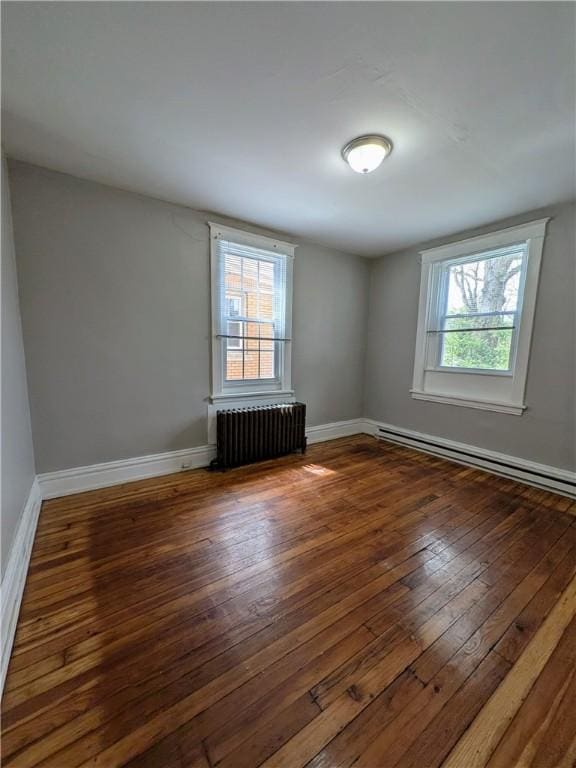 2759 Glen Mawr St, Sheraden, PA 15204 - spare room featuring radiator, a baseboard radiator, plenty of natural light, and wood-type flooring