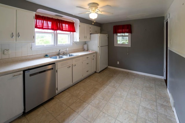 1153 Yanks Ln, South Park, PA 15236 - kitchen featuring dishwasher, a sink, freestanding refrigerator, light countertops, and tasteful backsplash